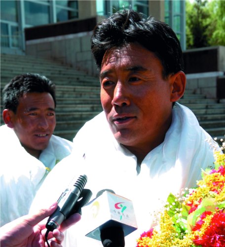 At 20 past one o??clock on June 4th of 2006, Luodro successfully reached the summit of Mt. Annapuma on the Nepalese side at 8091 metres above sea level. He is interviewed by reporters. Photo by Sonam Lozang